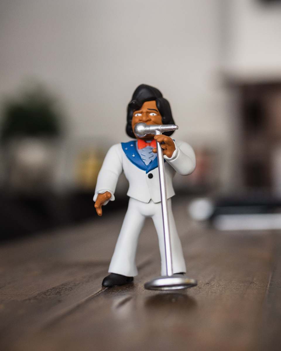 start digital man singing figurine on selective focus photography perth